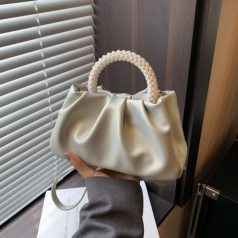 The handbag Lady 2024 Niche design Pearlescent new high-end pleated cloud bag pearl hand-held shoulder crossbody bag details Picture