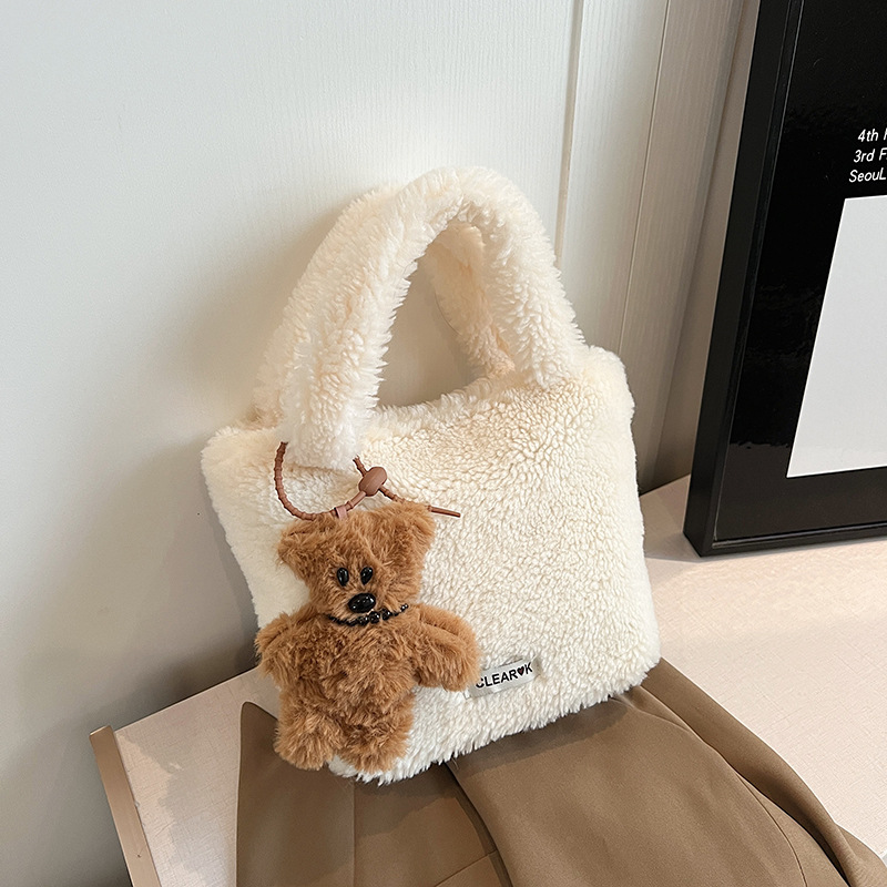 A fluffy hand-held bag for ladies in 2024, a trendy Maillard single-shoulder bag for commuting and casual use, a crossbody bucket bag Specification drawing
