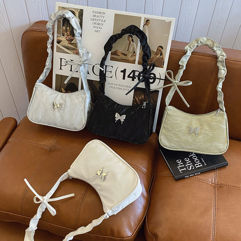 The popular solid-color bow underarm bag 2025 new style simple and casual handbag with pleated, stylish and fashionable shoulder bag Application Scenario