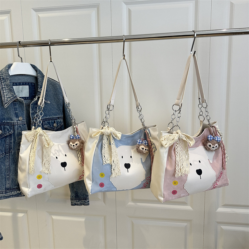 This is a new style of women's bag for 2025, featuring a fashionable and cute dog-patterned design. It's a single-shoulder crossbody bag and a literary bucket bag Application Scenario