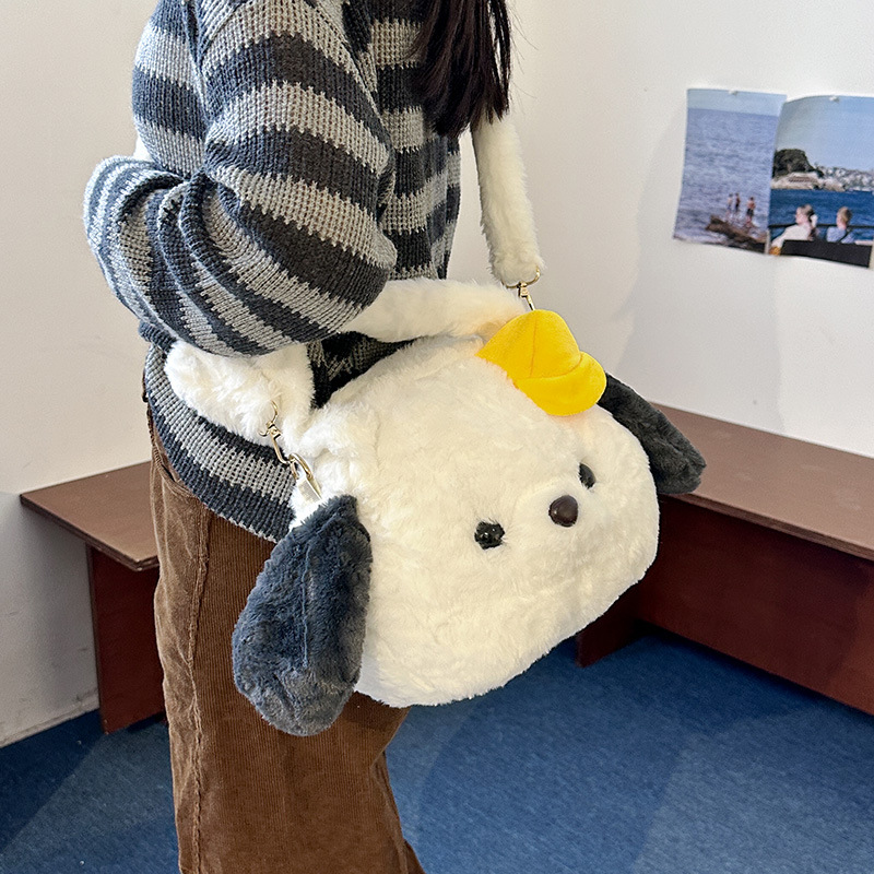 A new style of girl's hand-held crossbody bag with a cute big head doll. Carry the bag when going out to store the crossbody travel bag Application Scenario