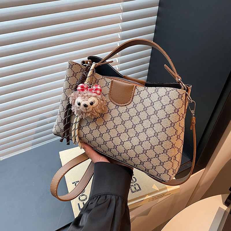 Cross-border Women's Bag 2025 New style printed color-blocking hand-held single-shoulder bucket bag, casual mobile phone bag, high-quality commuting bag full figure