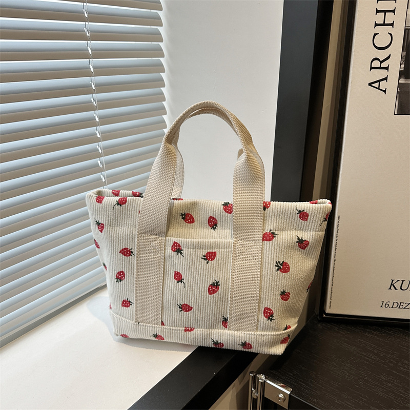 A cute Japanese strawberry corduroy handbag for women, new style 2024, fashionable and versatile, convenient to use as a small bag for mommy full figure