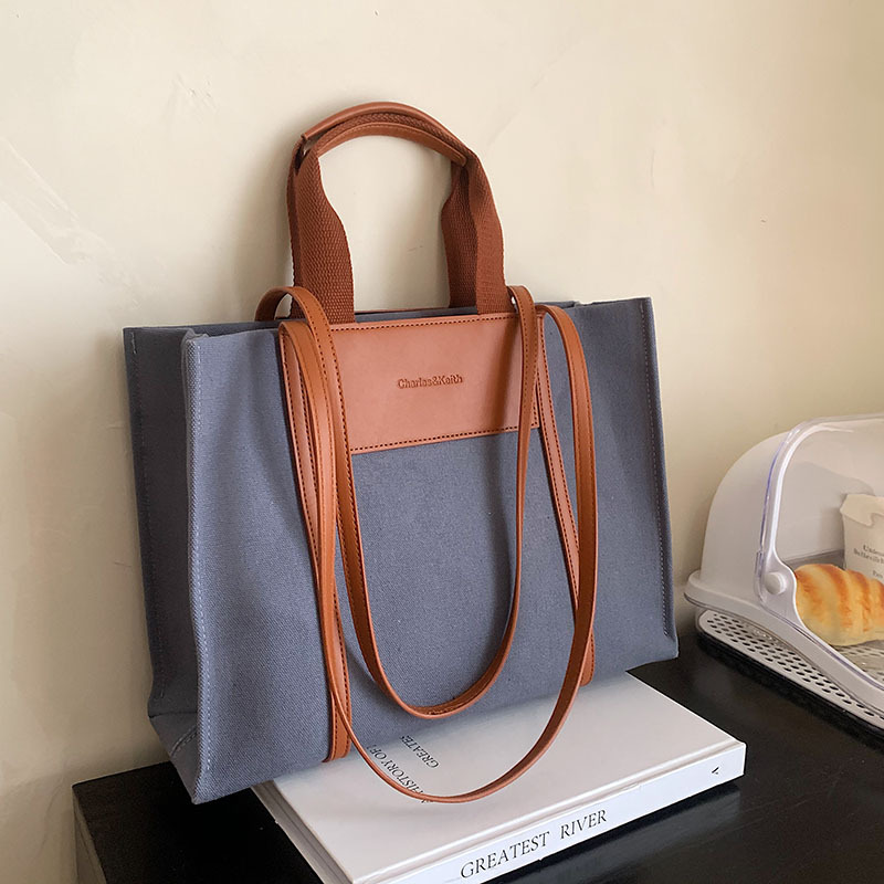 A new 2025 fashionable and casual canvas bag, a large hand-carry bag for university commuting, a versatile and trendy women's large-capacity tote bag details Picture
