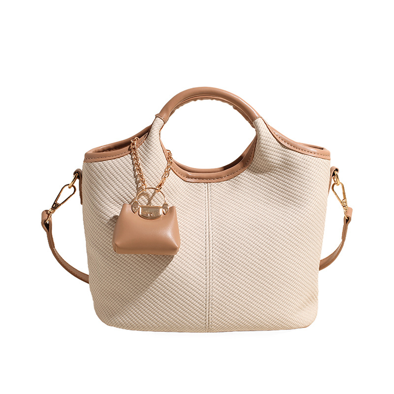A new retro and versatile crossbody bag for women in 2025, a high-end hand-carry casual bucket bag for work Item Picture