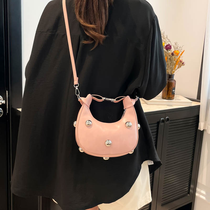In 2025, a simple, stylish, casual and individualistic hot girl style riveted new trend crossbody hand-held dumpling bag for women's commuting details Picture