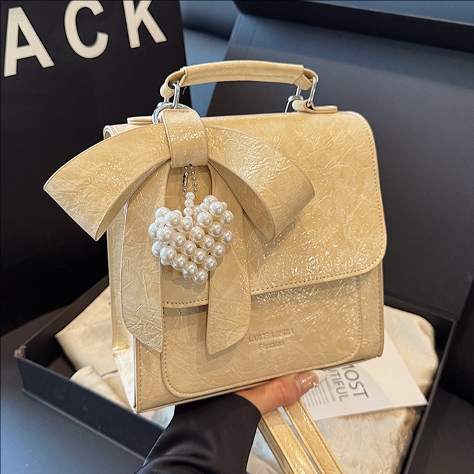 Cross-border Korean-style high-end bow backpack for women, a new trendy, fashionable and niche design single-shoulder bag for summer 2025 full figure