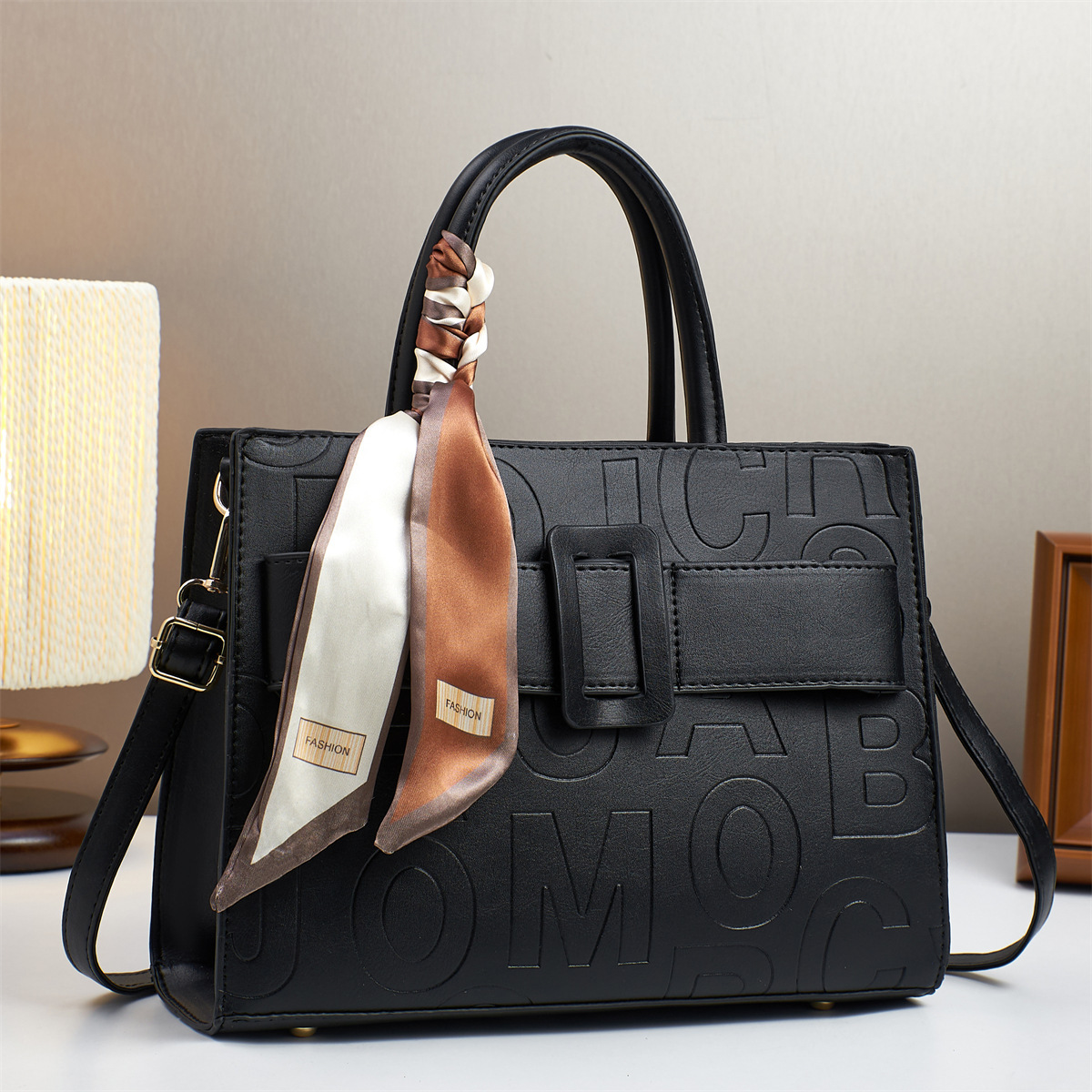 The 2025 new letter embossed handbag features a fashionable design. It is a simple and versatile bag for cross-border use, making it a perfect gift for mom and girl full figure