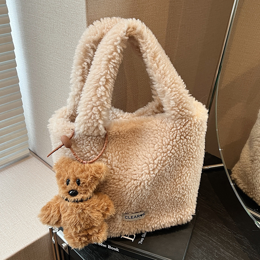 A fluffy hand-held bag for ladies in 2024, a trendy Maillard single-shoulder bag for commuting and casual use, a crossbody bucket bag full figure