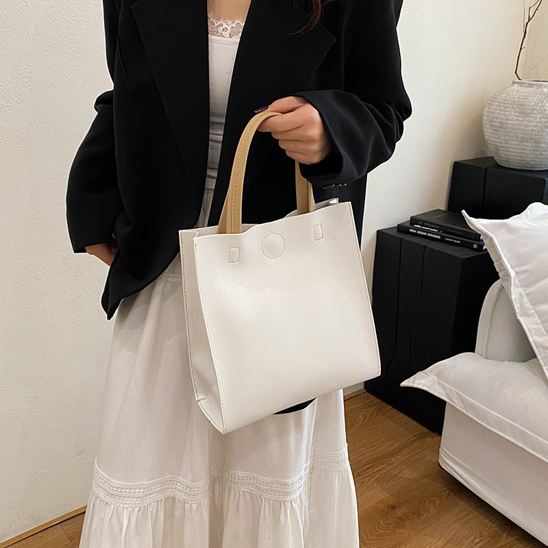 A popular vertical women's bag, 2025 new style, Korean style trendy commuting bag, large-capacity hand-held tote bag details Picture