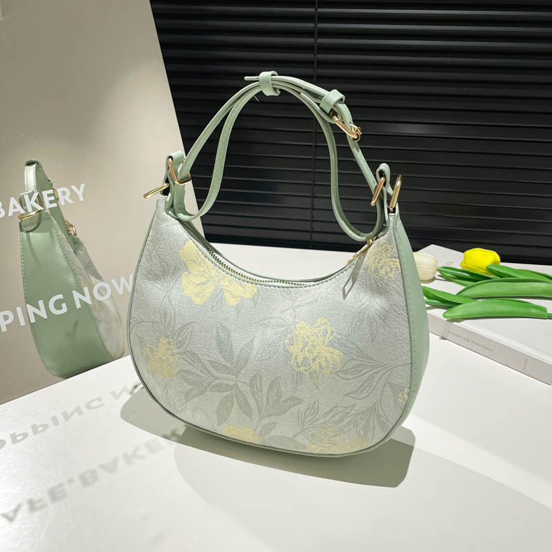 A new Chinese-style hand-held small bag for women in 2025, a trendy and fashionable crossbody bag, a niche commuting dumpling bag full figure