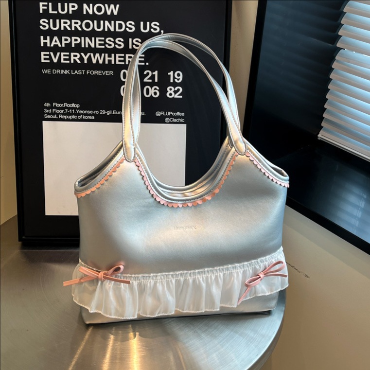 The new large-capacity tote bag for summer 2025 is a versatile and casual choice for women. It features a bow underarm bag and a lace shoulder bag for commuting full figure