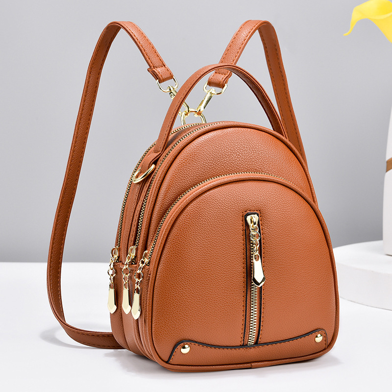The 2024 new stylish Korean-style trendy small backpack is simple and elegant. It features a single-shoulder crossbody small round bag and a double-shoulder women's bag details Picture