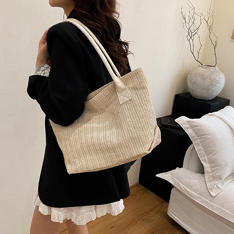 2025 Korean version hand-held woven bag Spring/Summer New style, fashionable and simple Tote bucket bag, women's large-capacity commuter bag details Picture