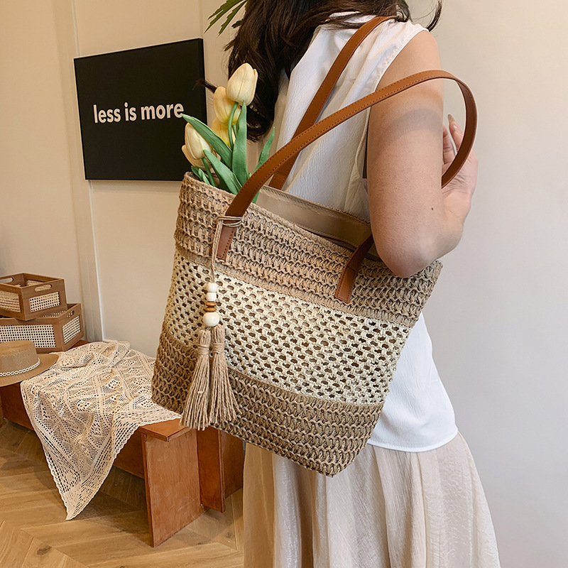 Summer stylish and hollowed-out hand-held straw woven bag 2025 new style versatile beach vacation single-shoulder woven bucket bag details Picture