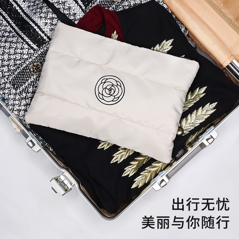 The new Camellia little Fragrance hand-held makeup bag features a large capacity, high appearance level, portable makeup bag and travel toiletries Application Scenario