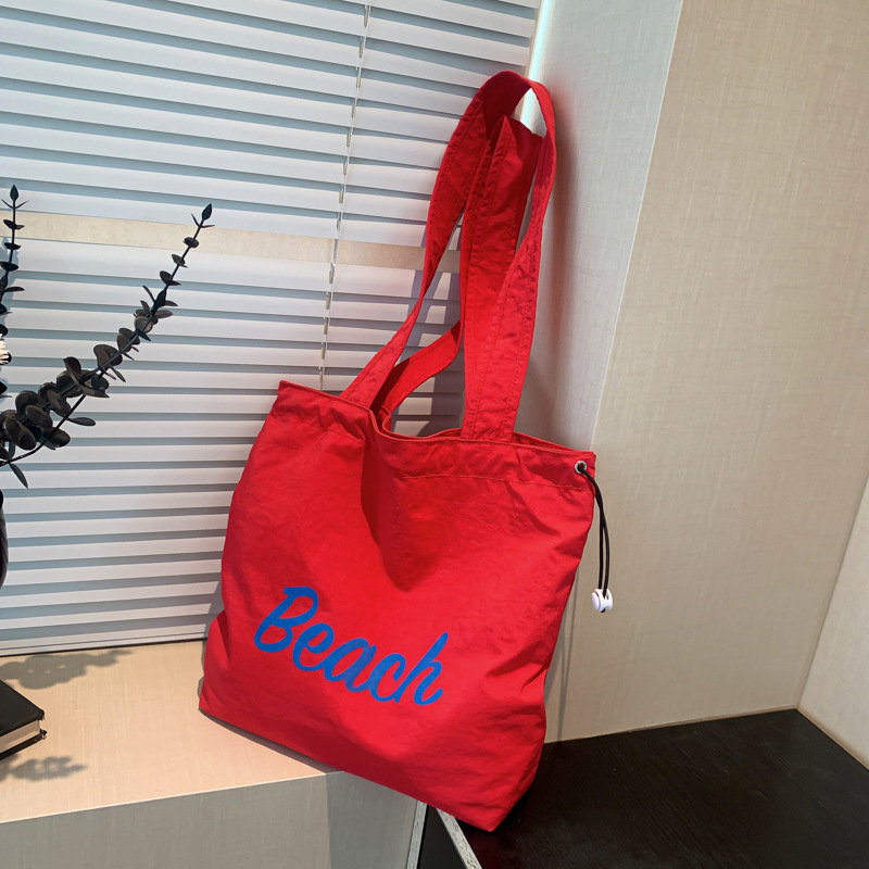Korean summer new canvas bag, large-capacity shopping bag, commuter single-shoulder bag, simple letter drawstring handbag full figure