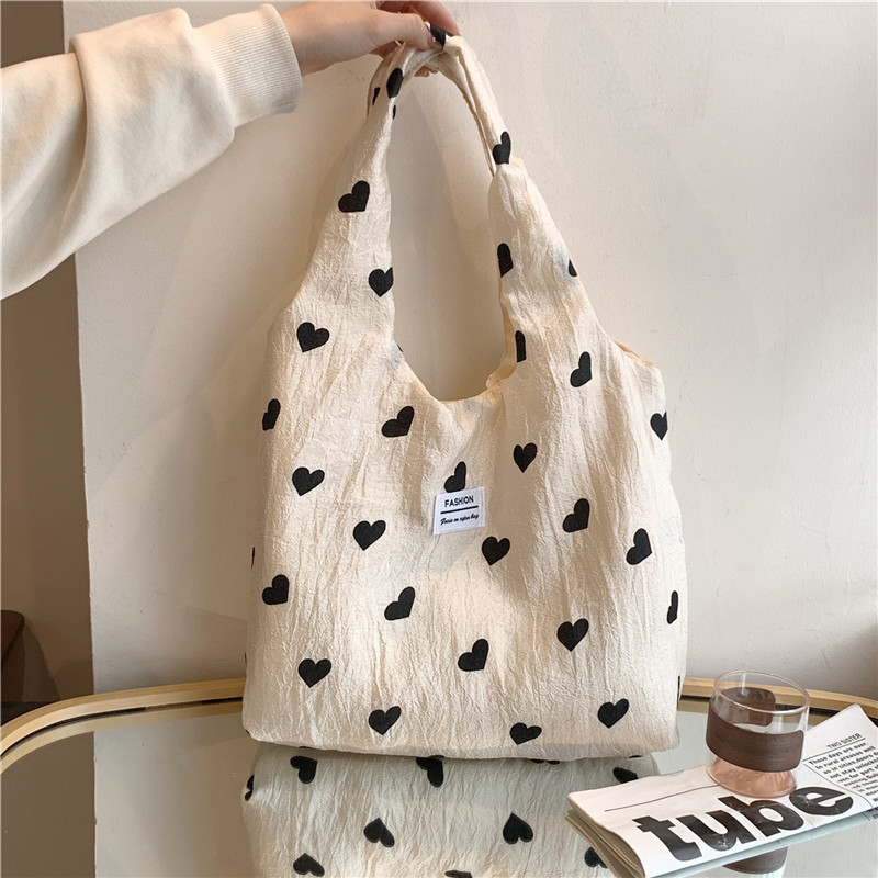 New cross-border textured heart-shaped canvas single-shoulder backpack, large-capacity handbag, high-quality commuting underarm bag full figure