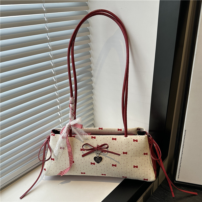A niche color-blocking bag for women in 2025, a fashionable and versatile crossbody bag, a sweet and cool girl's hand-held bucket small bag full figure