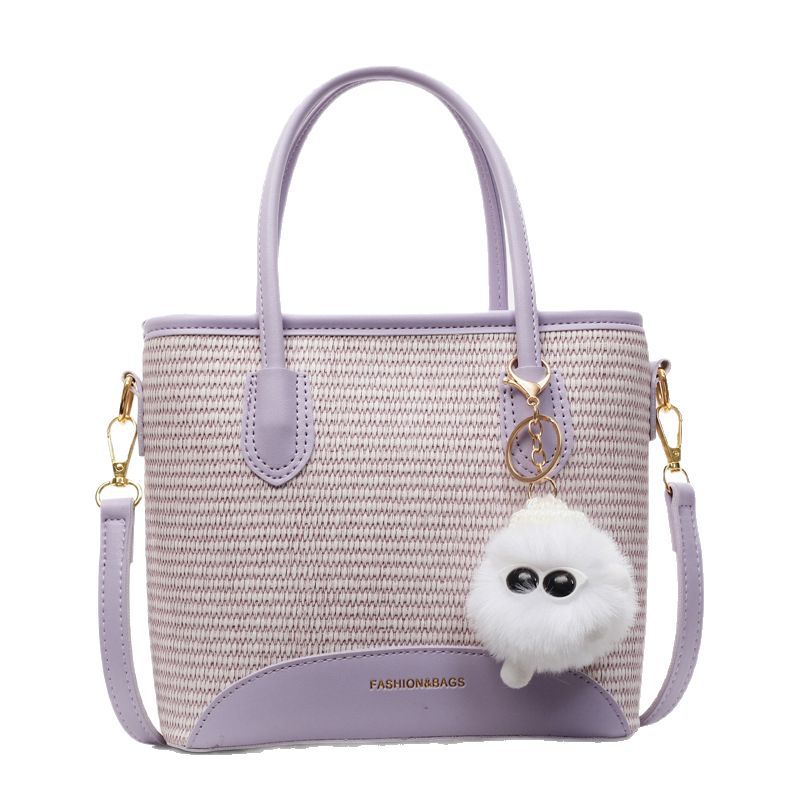 Korean niche design simple and casual hand-held bucket bag for women 2025 summer, a new straw weaving versatile crossbody bucket bag Item Picture