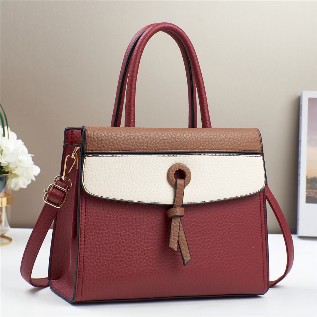 The new color-blocking handbag for foreign trade is a versatile single-shoulder tote bag with a fashionable color contrast and a high-end feel. It is a trendy crossbody bag with a patchwork design details Picture