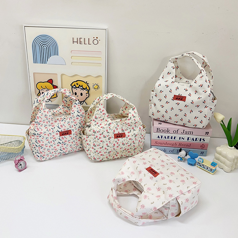 Fresh and delicate floral hand-held canvas bag 2025 new style large-capacity casual women's bag, versatile hand-held tote bag wholesale full figure