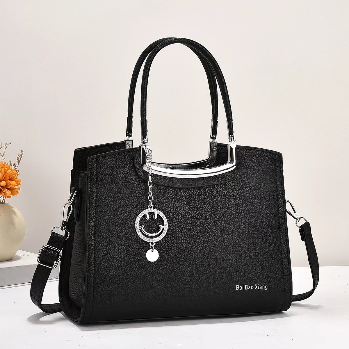 The new macaron handbag is a fashionable and trendy cross-border versatile women's bag with a high-end feel. It features a large capacity single-shoulder bag and a crossbody bag details Picture