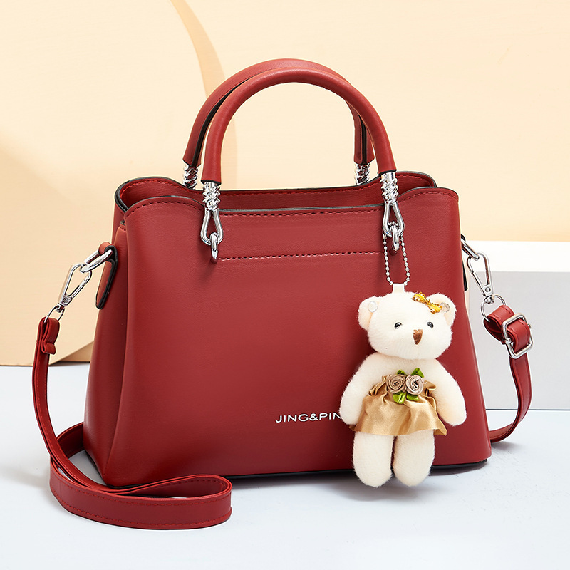 This 2024 new style of fashionable handbag is a trendy and elegant Korean-style single-shoulder lady's bag and a stylish bear crossbody bag details Picture