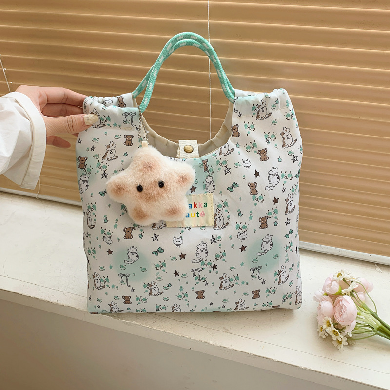 The new ins canvas single-shoulder bag for spring and summer is a fresh and large-capacity student class backpack with a cute hand-held canvas bag full figure