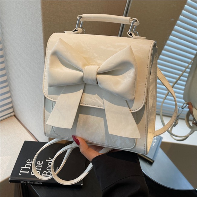 Bowknot casual large-capacity commuter backpack for women 2025 New style, stylish and solid color school style backpack full figure