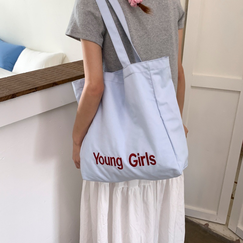 2025 New trendy lettered canvas bag for women with a laid-back style, large-capacity bucket bag, casual and versatile, fashionable single-shoulder bag details Picture