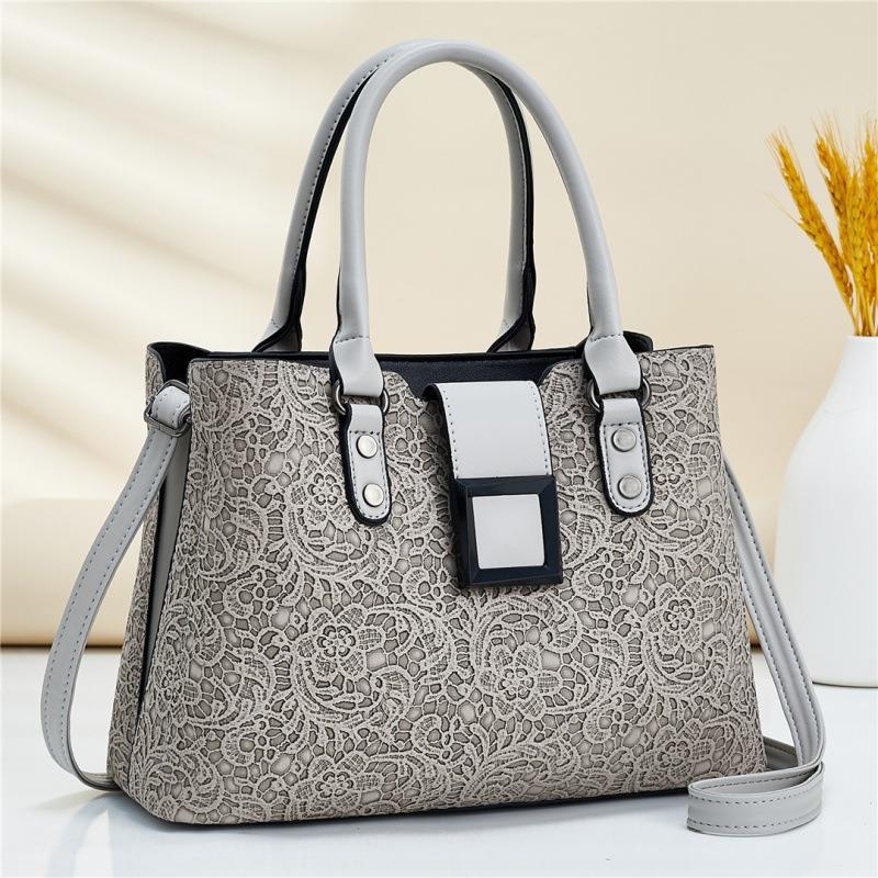 Wholesale of women's bags 2022 new style embossed bags, European and American fashion lace pattern single-shoulder hand-carry crossbody bags, export consignment details Picture