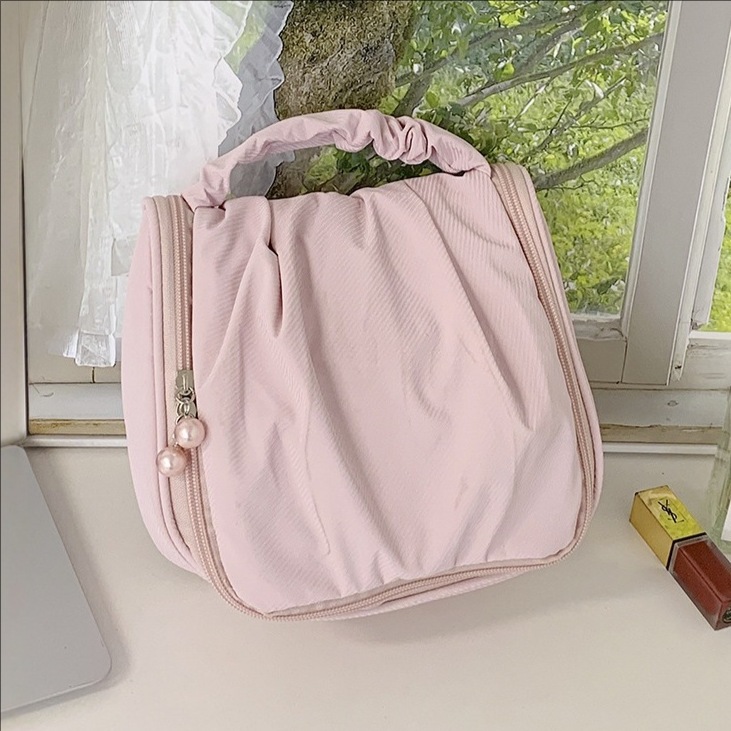 2025 New cute pearl large-capacity portable hand-held makeup bag, multi-functional toiletry and travel storage bag full figure