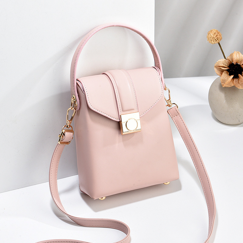 The 2024 new style of the niche design pocket money mobile phone bag is sweet, fashionable and cute. It's a small crossbody bag for girls in soft leather and solid color full figure