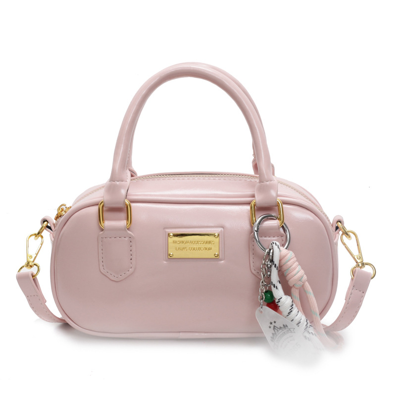 High-end, fashionable and retro bowling bag for women, 2025 new style, casual and elegant hand-held small bag, commuter crossbody bag Item Picture