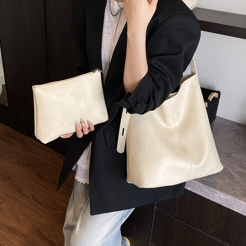 Cross-border high-end quality hand-held bucket bag for women 2025 new style, versatile and fashionable solid color, stylish commuting single-shoulder bag details Picture