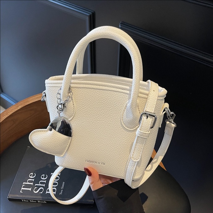 A high-end and stylish hand-held bucket bag with lychee pattern for women, a new 2025 trendy and versatile crossbody bag, a super popular single-shoulder bag full figure