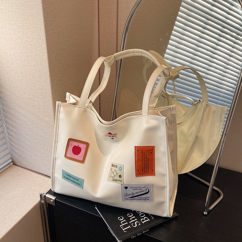 The 2025 new backpack is fashionable and versatile. The large-capacity tote bag is simple and cute for women. The cartoon sticker single-shoulder bag is trendy Specification drawing