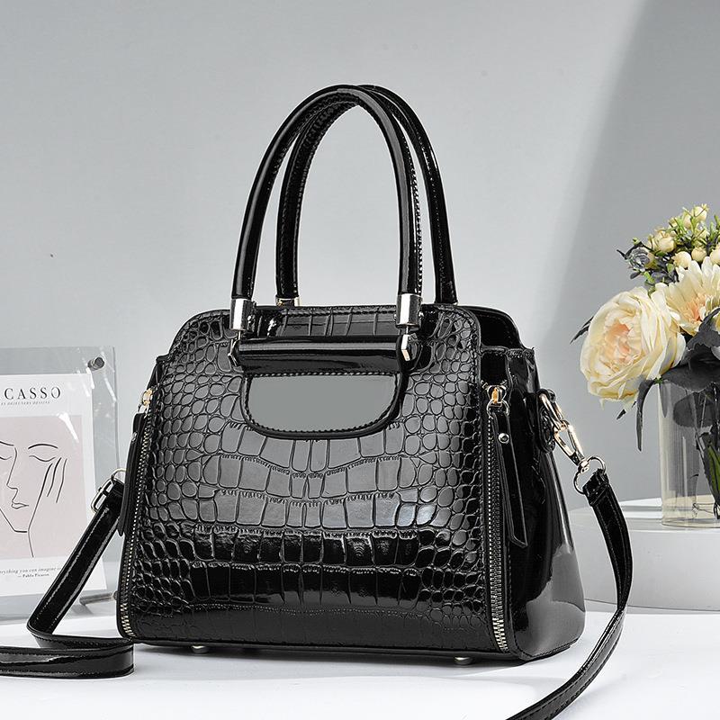 The 2023 new large-capacity crossbody bag for women is stylish and versatile. It's a single-shoulder hand-carry bag made of crocodile pattern shiny leather full figure