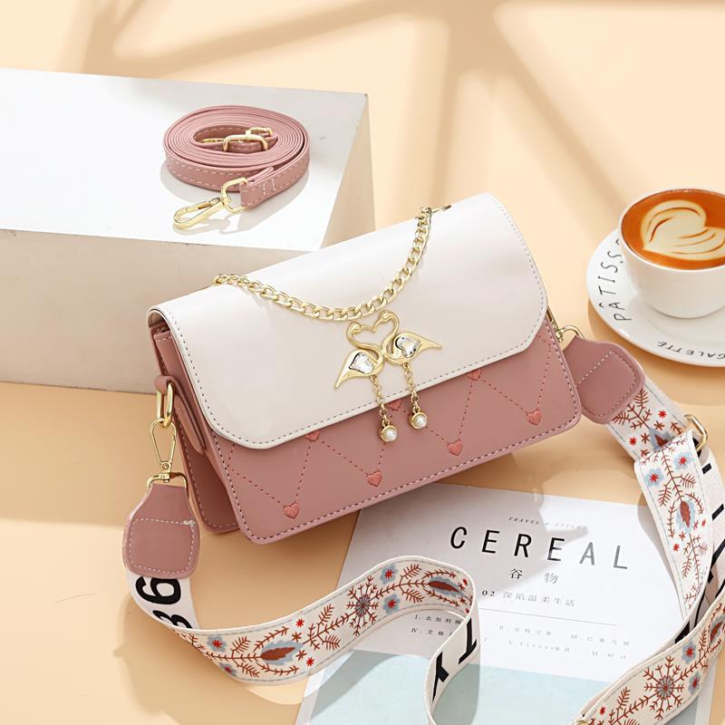 The new exquisite embroidered heart-shaped small square women's bag for autumn and winter is stylish and high-end. It's a one-shoulder crossbody bag with a swan color contrast Application Scenario
