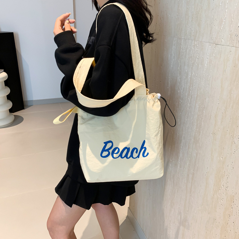 Korean summer new canvas bag, large-capacity shopping bag, commuter single-shoulder bag, simple letter drawstring handbag Specification drawing