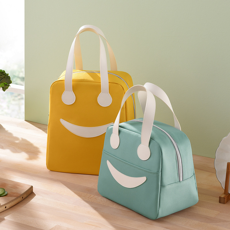 Runhui bags are portable, cute and smiling bento bags, insulated bags for bringing meals to work, student lunch bags and hand-held ice packs details Picture