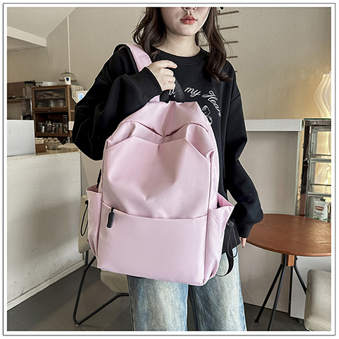 New Korean-style versatile backpack, solid color texture, girls' high school backpack, college students' computer bag, texture cross-border bag Application Scenario