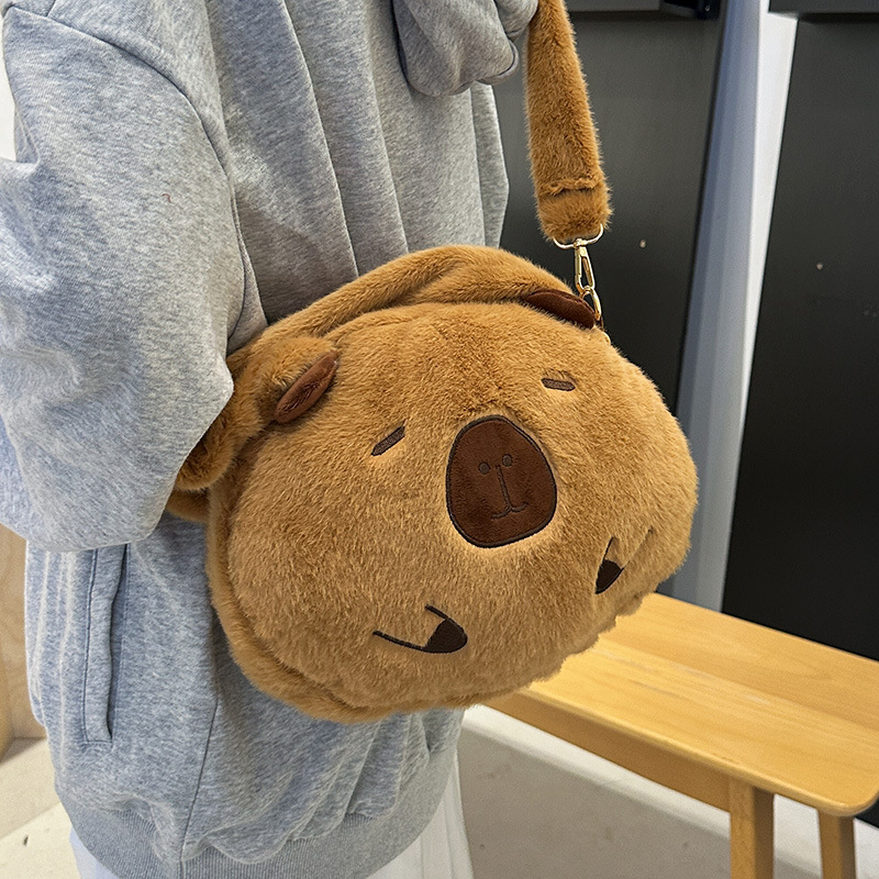 A new style of girl's hand-held crossbody bag with a cute big head doll. Carry the bag when going out to store the crossbody travel bag Specification drawing