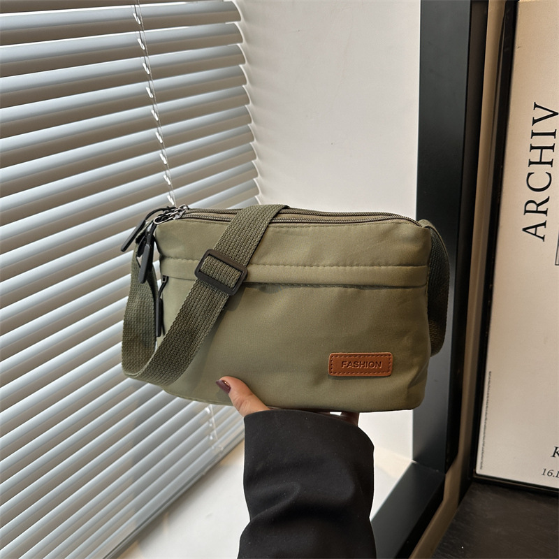 2025 New simple solid color nylon fabric bag for women, multi-functional casual, waterproof, portable and fashionable single-shoulder crossbody bag full figure