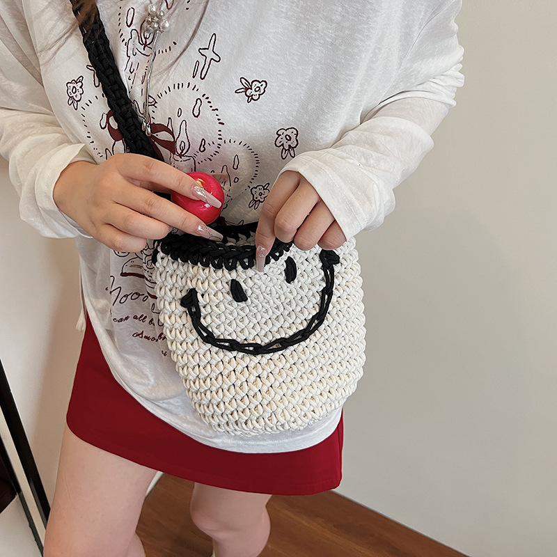 2025 New style simple bucket bag, niche women's bag, smiling knitted bag, single-shoulder bag for going out, and crossbody bag for seaside travel Specification drawing