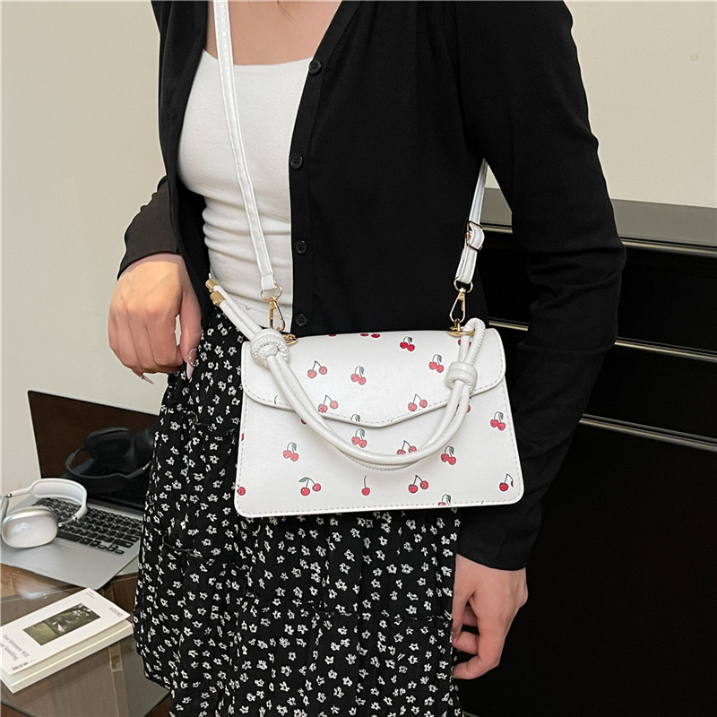 A fresh and elegant cherry fashion handbag for women in summer 2025, a trendy and niche crossbody bag, a sweet and stylish small square bag details Picture