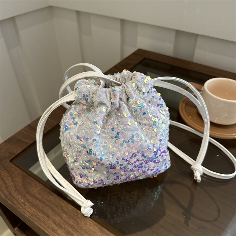 A stylish sequined drawstring bucket small bag for women in 2024, a unique and colorful crossbody bag full figure