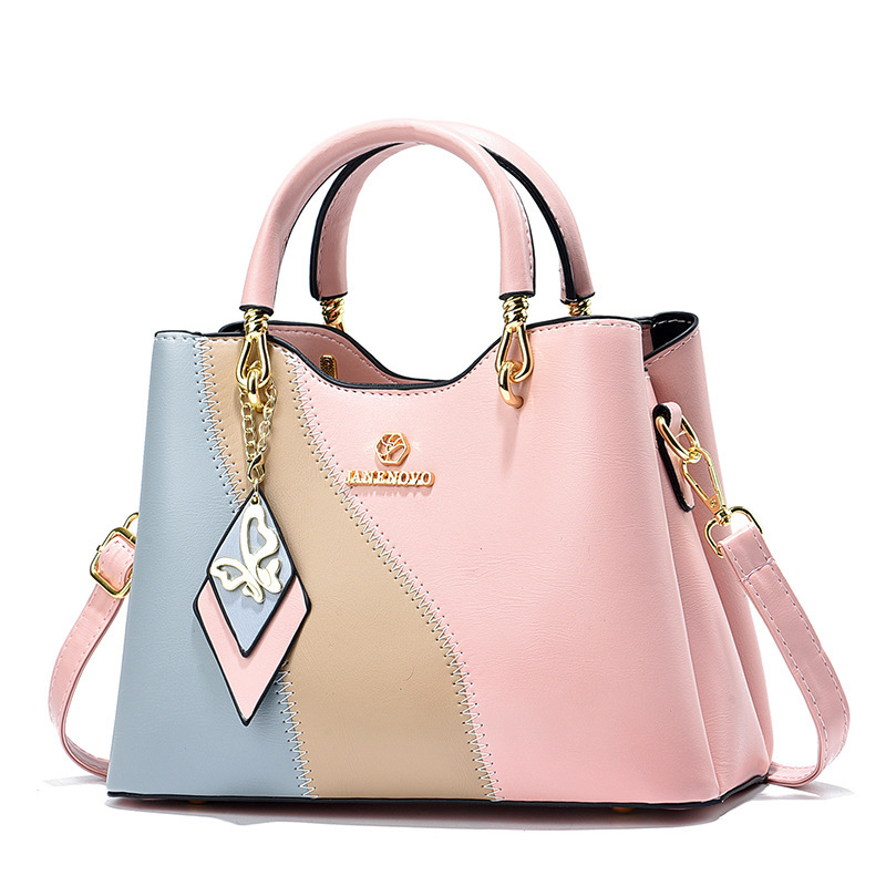 This is a new high-end Korean-style trendy handbag for women in spring 2024. It features a sweet and elegant style with a color-blocking design and a crossbody bag full figure