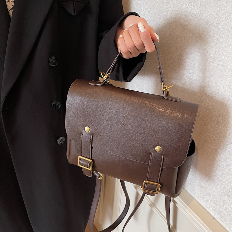 This is a new 2024 retro casual hand-held Japanese student backpack with a large capacity for women. It is a high-end travel backpack full figure